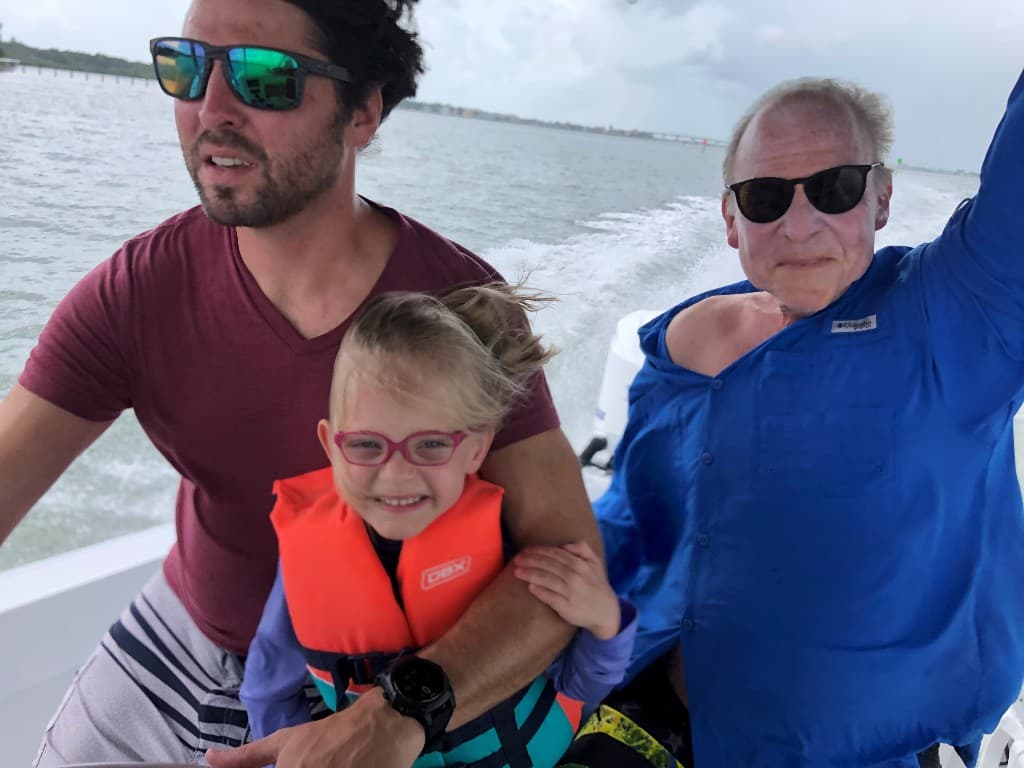 Dr. Beau Swann with family on the water — Brad, Beau, and Dr. Russell Swann enjoying a boat day together